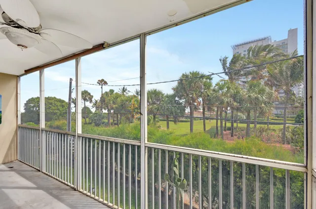 a view of balcony with yard