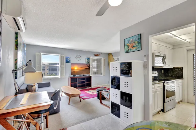 a living room with furniture flat screen tv and a fireplace