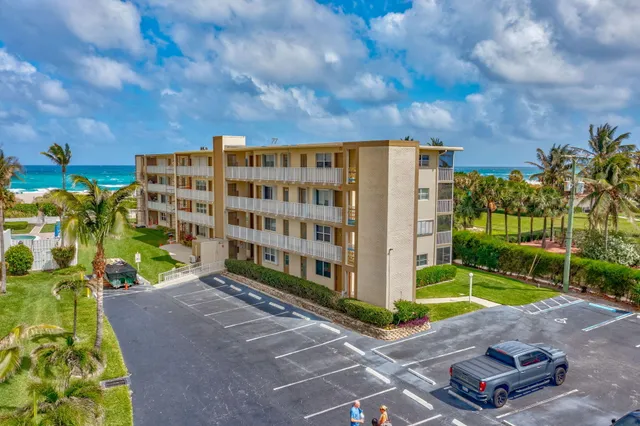 a view of a building with a yard