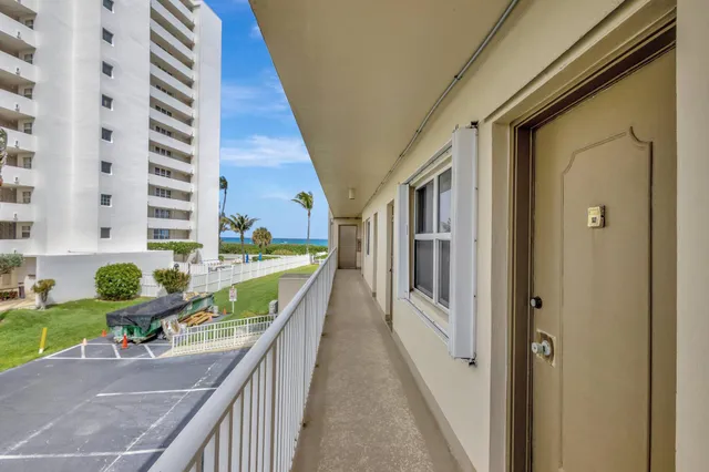 a house view with balcony and outdoor space