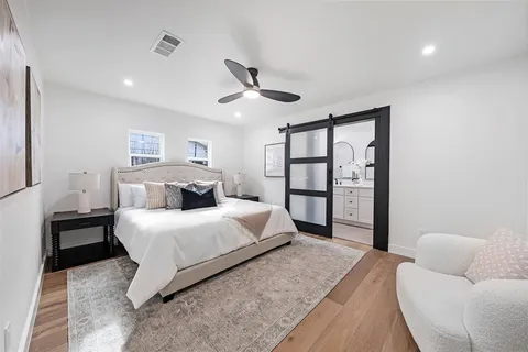 a bathroom with a double vanity sink mirror and shower