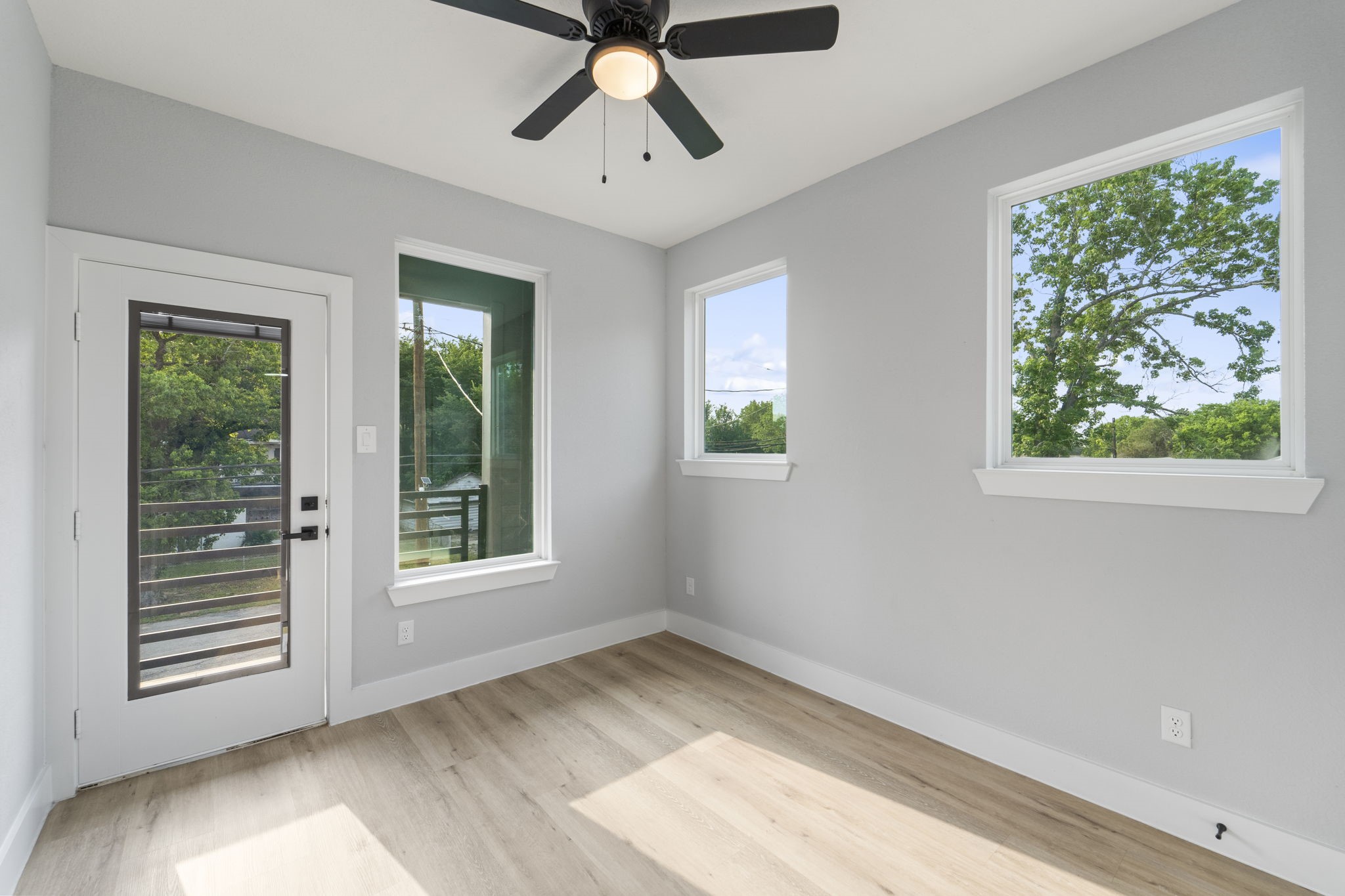 6631 Foster Street Houston, TX 77021 - Photo 16 of 21 a view of empty room with wooden floor and fan