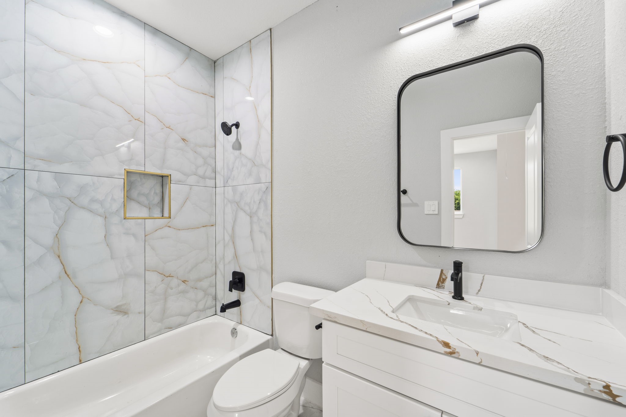 6631 Foster Street Houston, TX 77021 - Photo 7 of 21 a bathroom with a sink a toilet and shower