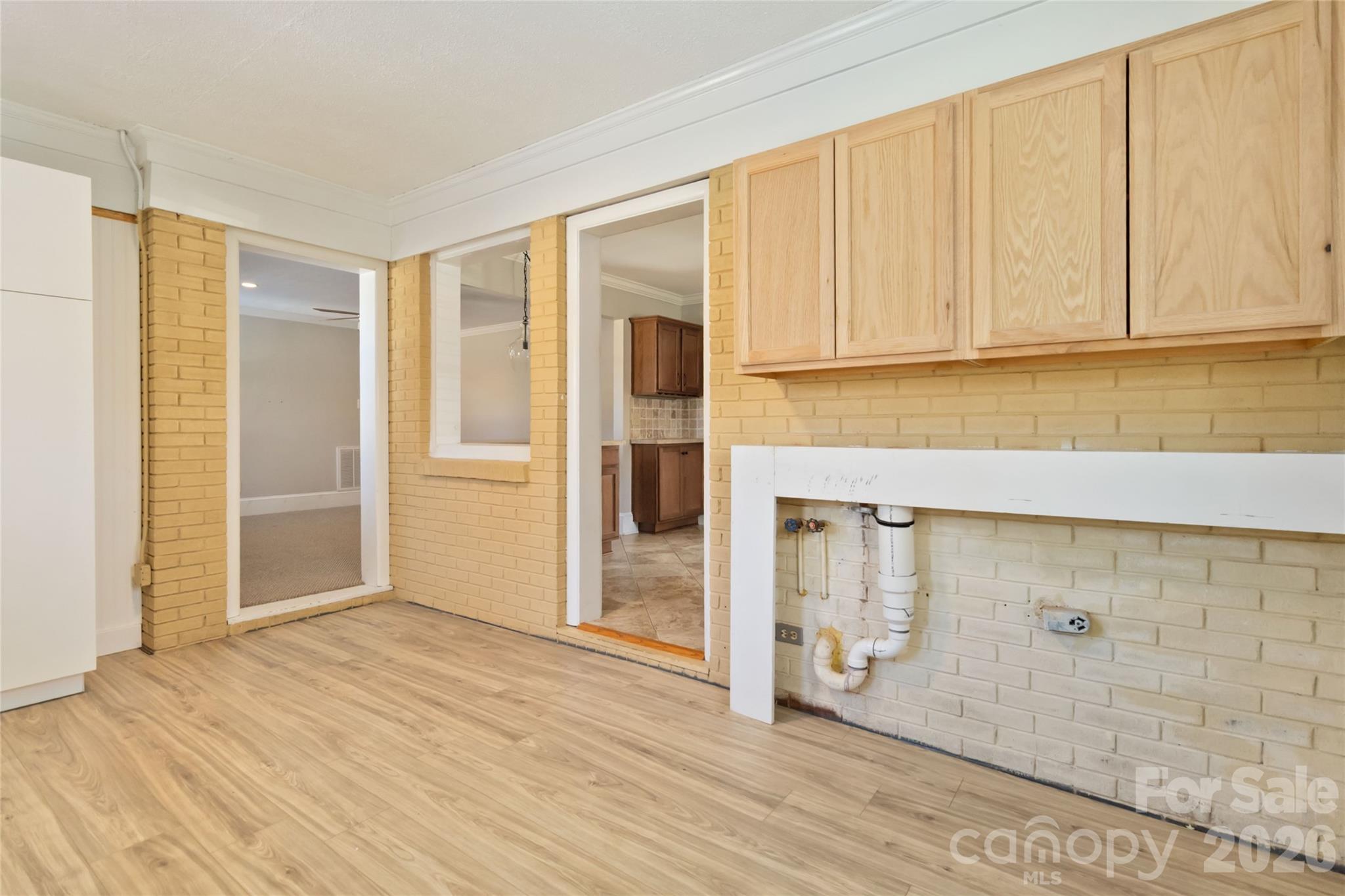 3750 Havenwood Road Charlotte, NC 28205 - Photo 20 of 37 a view of an empty room with wooden floor and cabinet