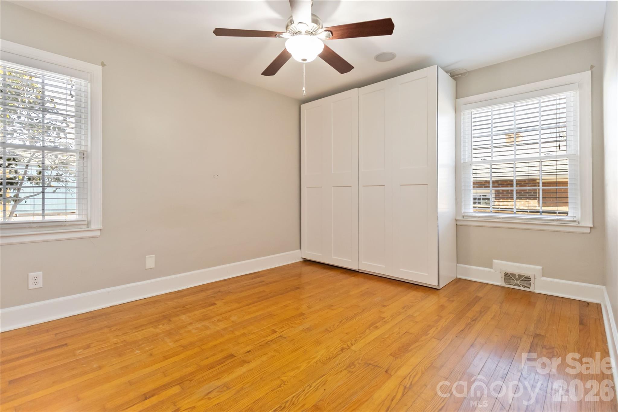 3750 Havenwood Road Charlotte, NC 28205 - Photo 27 of 37 a view of an empty room with wooden floor and a window