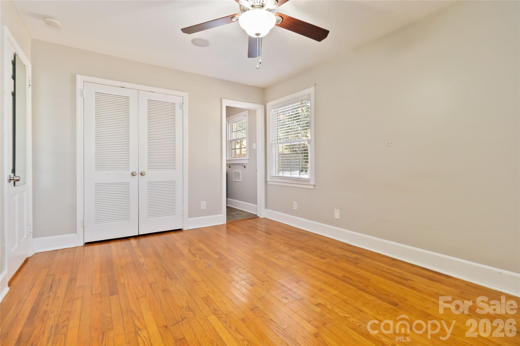 3750 Havenwood Road Charlotte, NC 28205 - Photo 28 of 37 a view of an empty room with wooden floor and a window