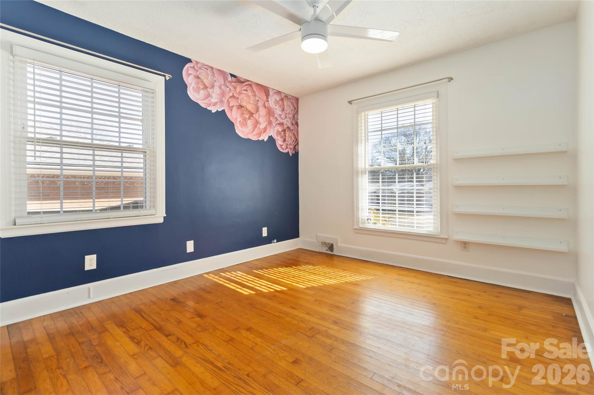 3750 Havenwood Road Charlotte, NC 28205 - Photo 29 of 37 a view of an empty room with a window and wooden floor