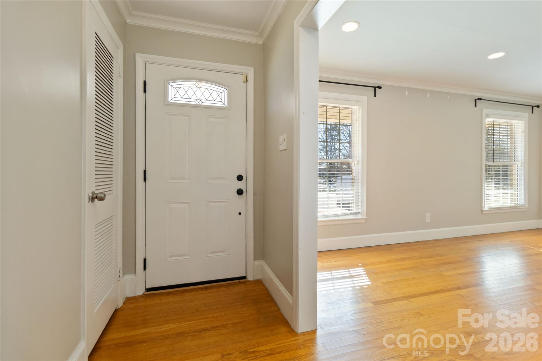 3750 Havenwood Road Charlotte, NC 28205 - Photo 4 of 37 a view of an empty room with wooden floor and a window
