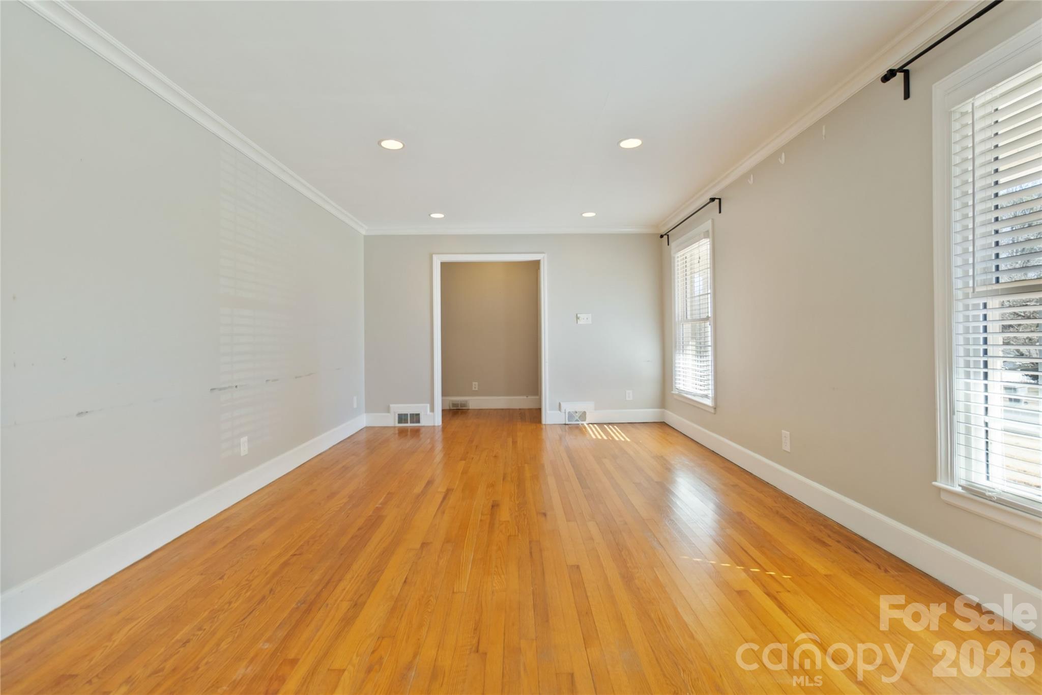 3750 Havenwood Road Charlotte, NC 28205 - Photo 6 of 37 a view of an empty room with wooden floor and a window
