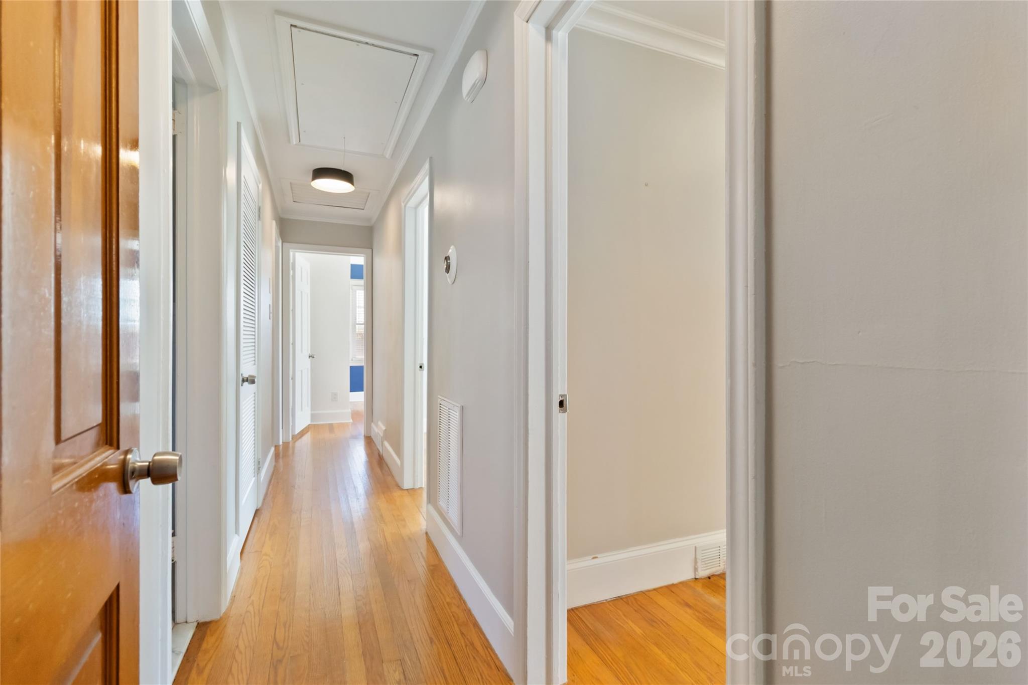 3750 Havenwood Road Charlotte, NC 28205 - Photo 9 of 37 a view of a hallway with wooden floor and staircase