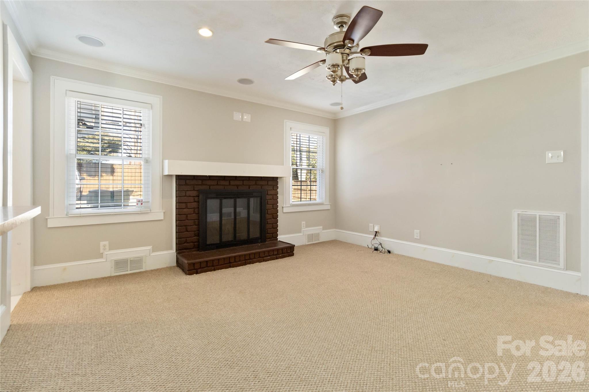 3750 Havenwood Road Charlotte, NC 28205 - Photo 10 of 37 an empty room with windows and fireplace