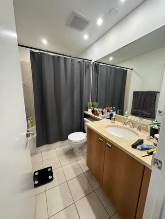 a kitchen with a sink appliances and cabinets