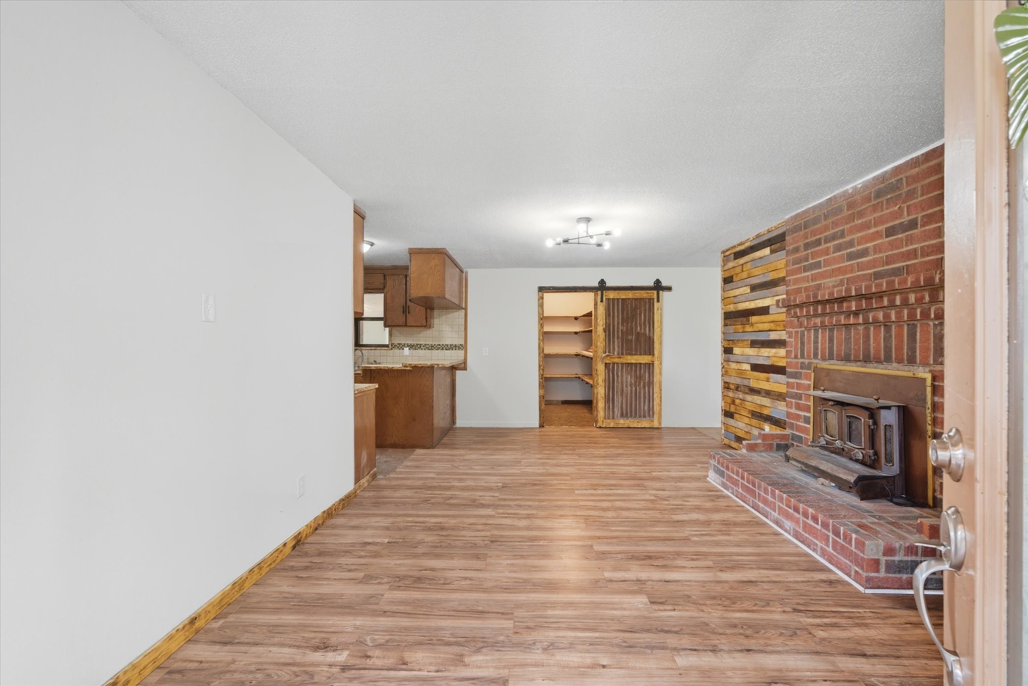 101 Merino Drive Huntsville, TX 77340 - Photo 6 of 42 Welcoming mud room with a wood burning fireplace