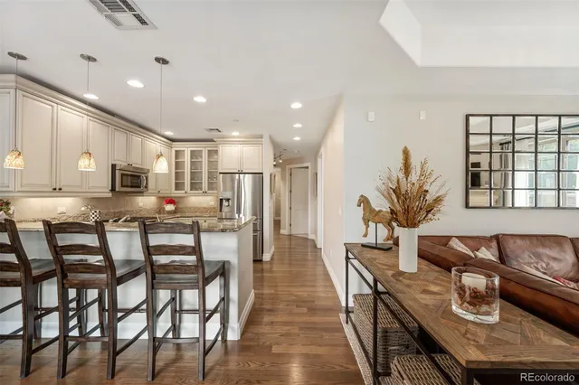 a dining room with furniture and wooden floor