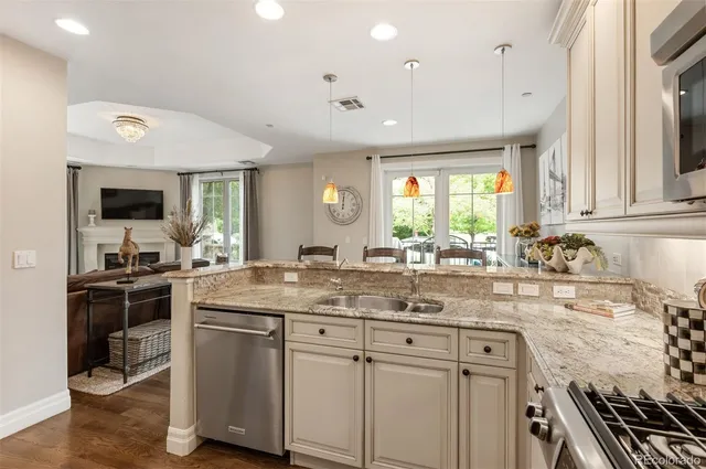 a kitchen with a sink stove and microwave