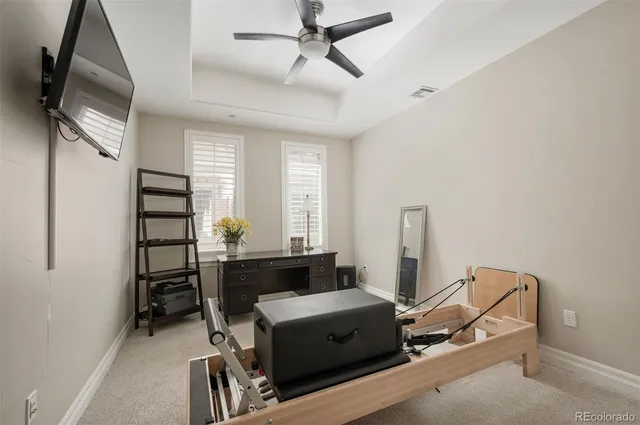a room with a chair and gym equipment