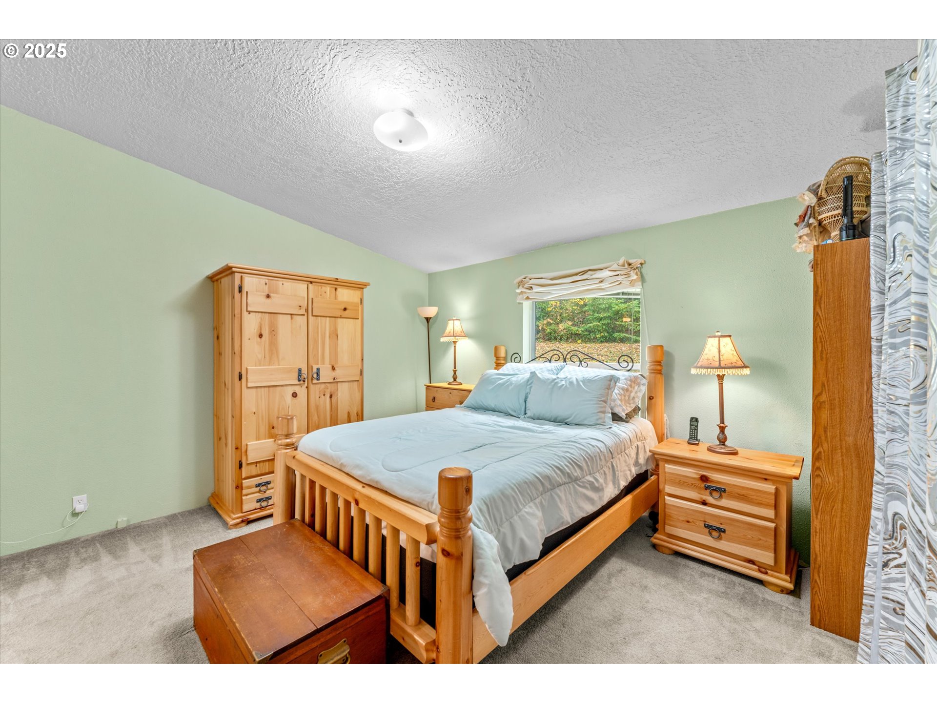 29010 Northeast 63rd Circle Camas, WA 98607 - Photo 13 of 30 a bedroom with a bed and wooden floor