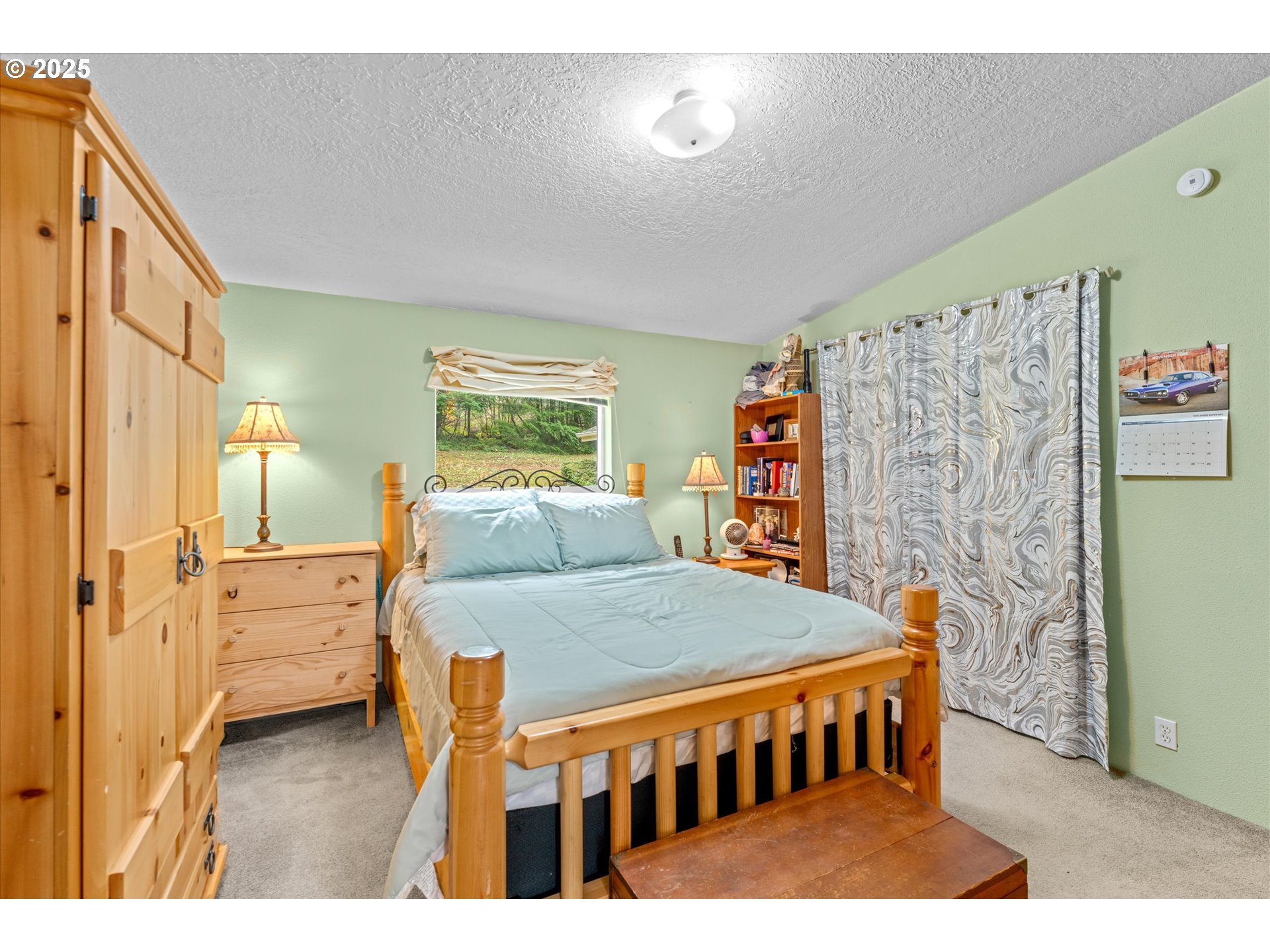 29010 Northeast 63rd Circle Camas, WA 98607 - Photo 14 of 30 a bedroom with a bed and a book shelf