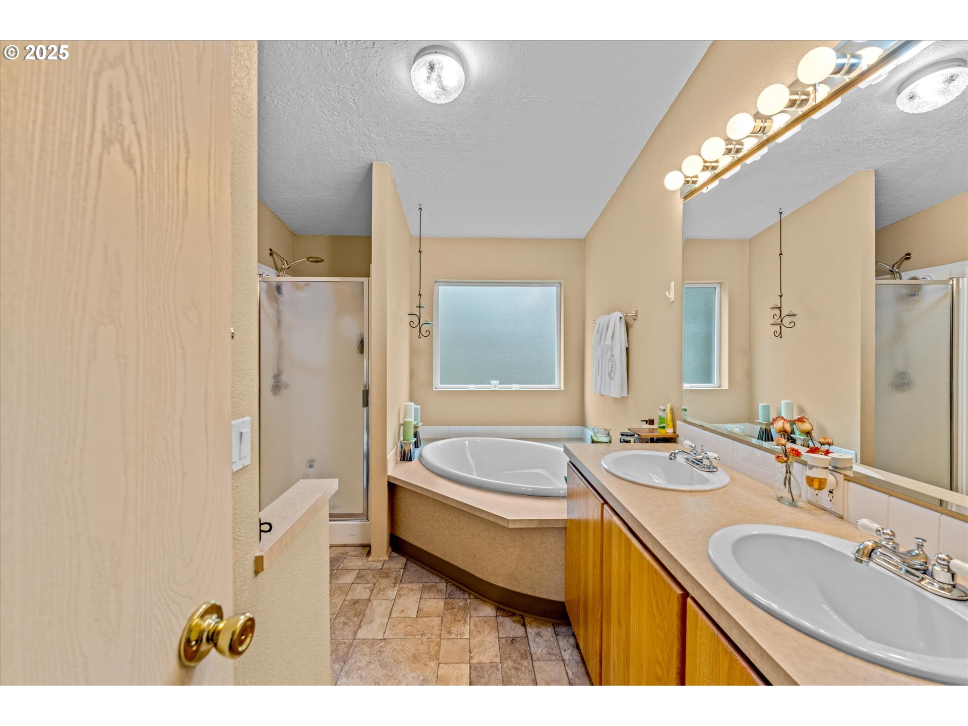 29010 Northeast 63rd Circle Camas, WA 98607 - Photo 15 of 30 a spacious bathroom with a tub sink and mirror
