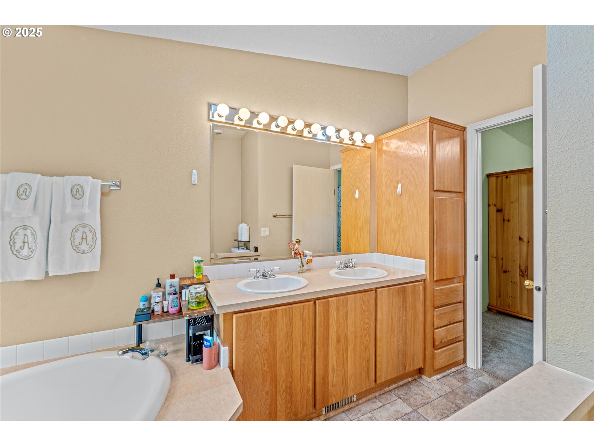 29010 Northeast 63rd Circle Camas, WA 98607 - Photo 16 of 30 a bathroom with a sink mirror and a shower