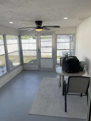 a room with gym equipment and a window