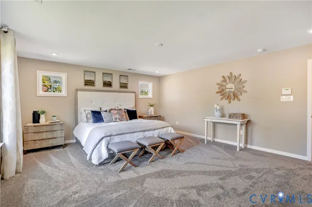 a bedroom with a bed and a couch