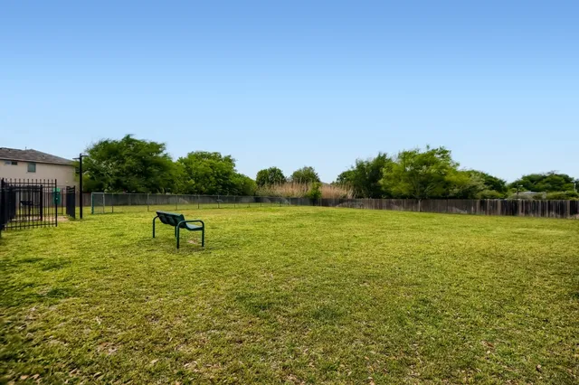 a view of a lake with a yard