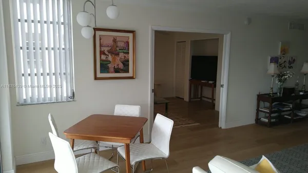 a view of a chair and tables in the balcony