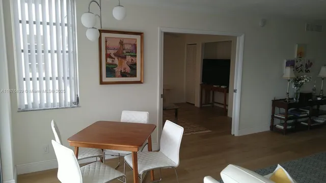 a view of a chair and tables in the balcony