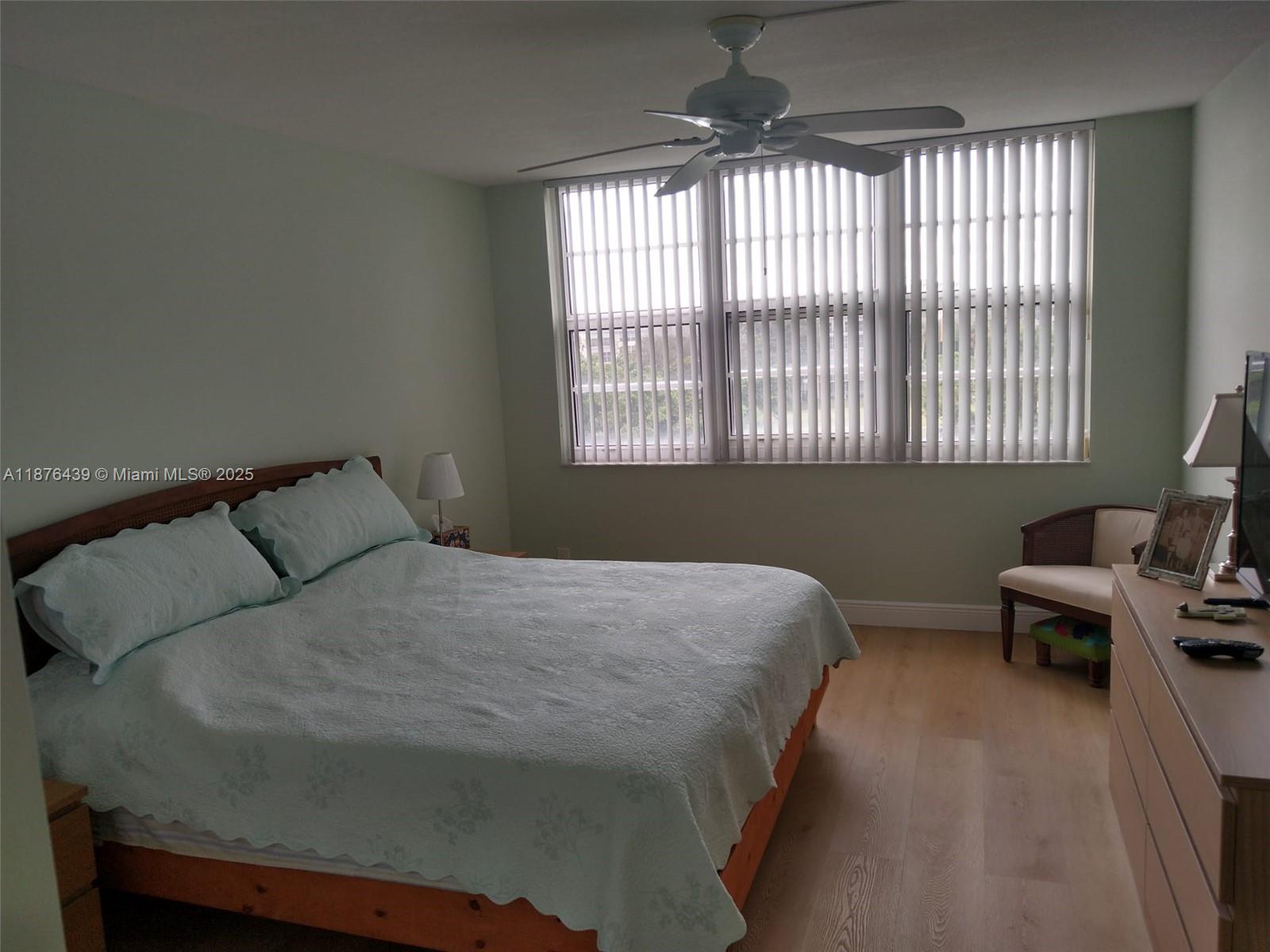 3510 Oaks Way, Unit 509 Pompano Beach, FL 33069 - Photo 24 of 36 a bedroom with a bed and a window