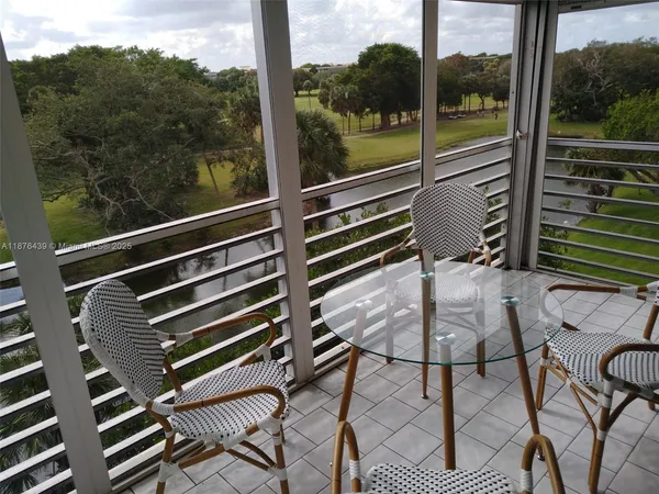 a view of a room with a large window
