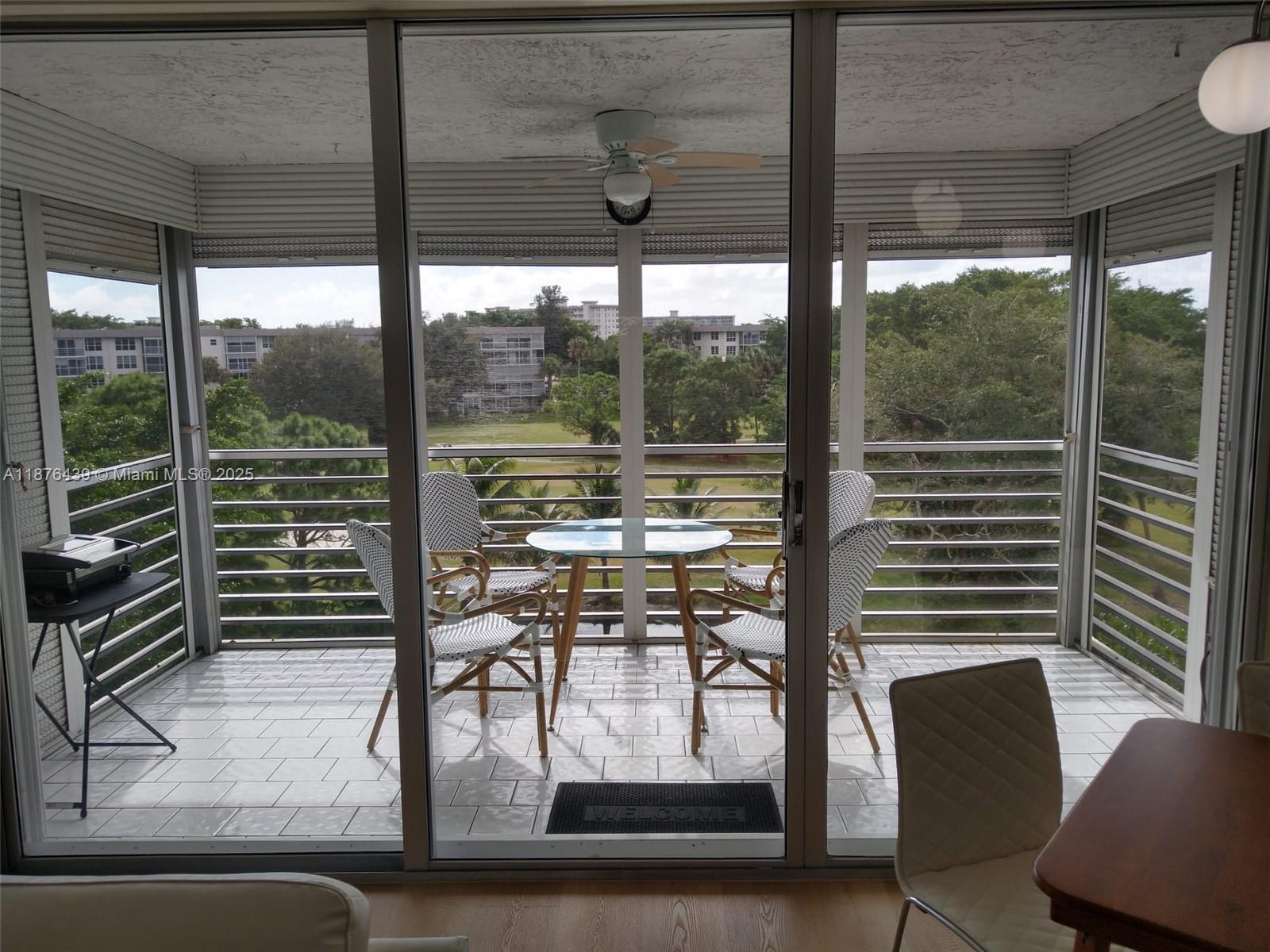 3510 Oaks Way, Unit 509 Pompano Beach, FL 33069 - Photo 29 of 36 a view of a room with a large window