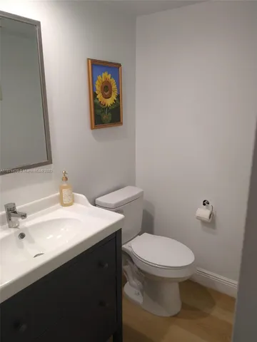 a view of a dining room with furniture wooden floor and chandelier