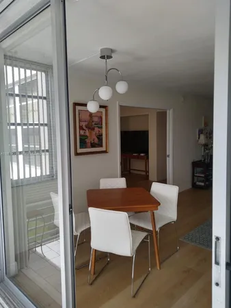 a view of a livingroom with furniture and a window