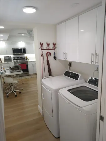 a living room with furniture a dining table and chairs