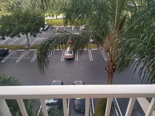 a modern kitchen with stainless steel appliances granite countertop a refrigerator and a stove top oven