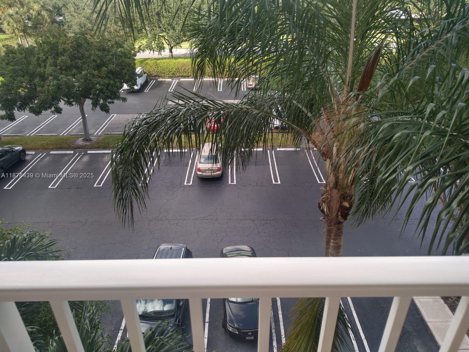 3510 Oaks Way, Unit 509 Pompano Beach, FL 33069 - Photo 4 of 36 a view of entryway with outdoor area