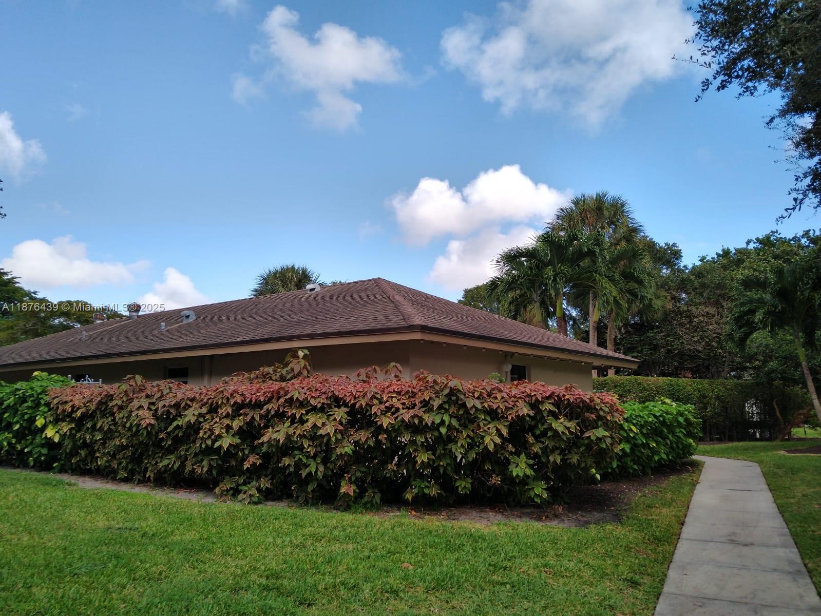 3510 Oaks Way, Unit 509 Pompano Beach, FL 33069 - Photo 6 of 36 a view of a back yard