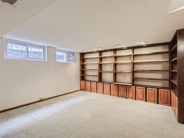 a view of an empty room with a stairs