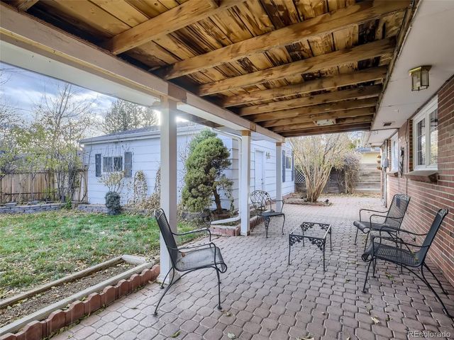 a view of yard with patio