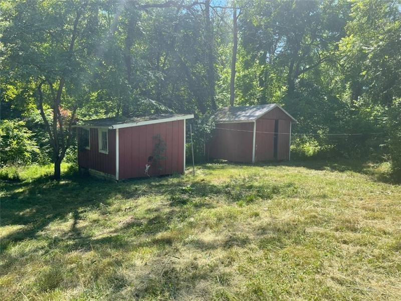 167 Vanderbilt Road Dickerson Run, PA 15430 - Photo 14 of 15 a backyard of a house with lots of green space and garden