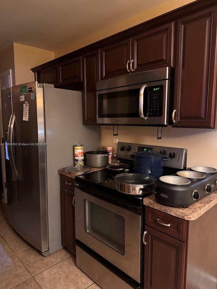 164 Deloris Madison Drive Midway, FL 32343 - Photo 34 of 41 a kitchen with stainless steel appliances granite countertop a stove and a microwave