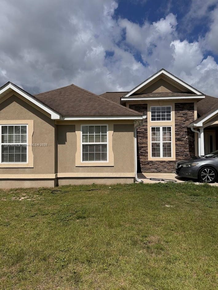 164 Deloris Madison Drive Midway, FL 32343 - Photo 40 of 41 a front view of a house with a yard
