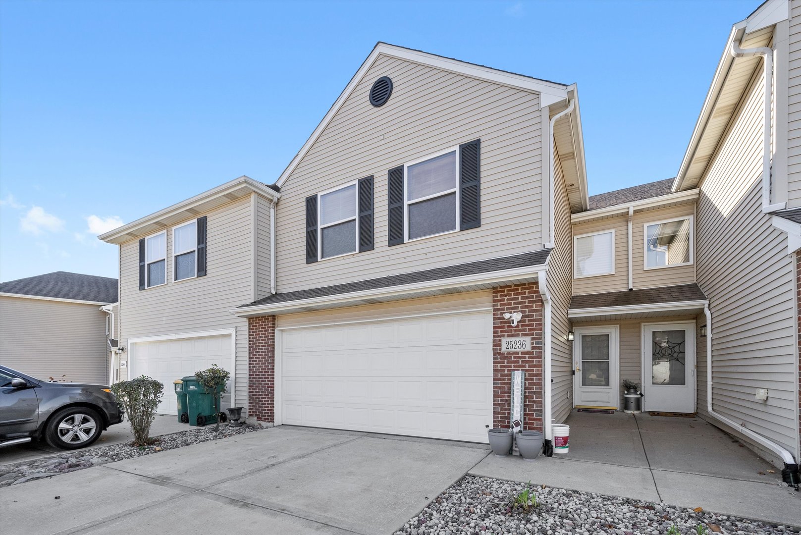 a view of a white house with many windows