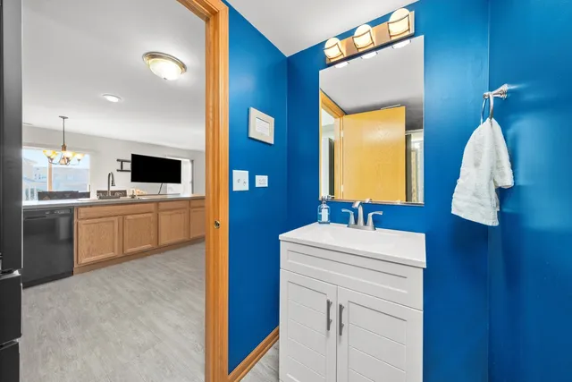 a bathroom with a sink a vanity and mirror