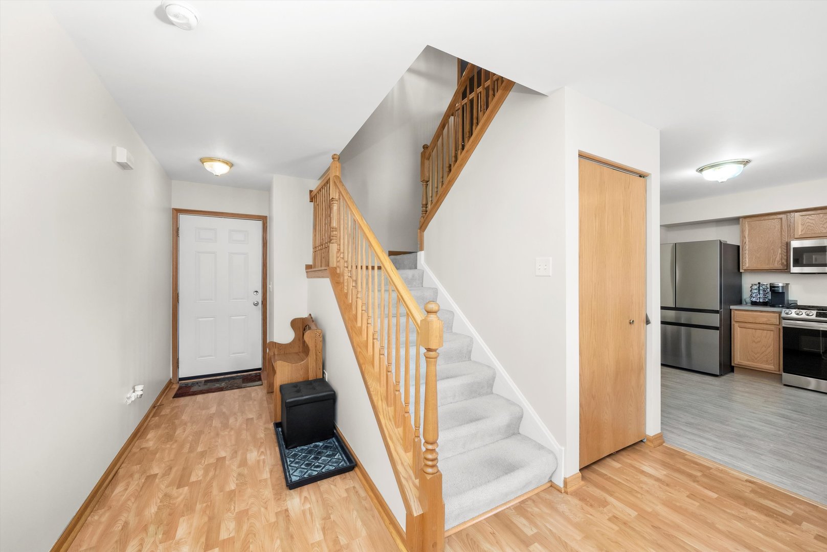 25236 Faraday Road Manhattan, IL 60442 - Photo 6 of 20 a view of a hallway with wooden floor and staircase