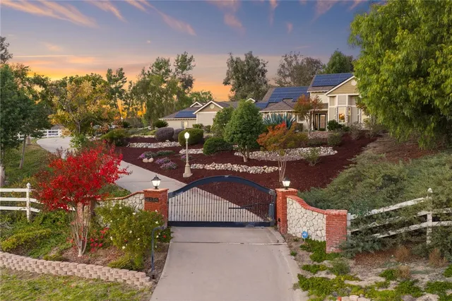 an aerial view of a house with outdoor space