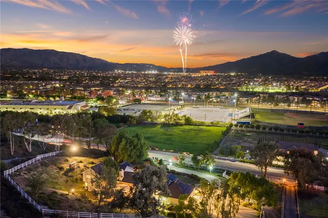 an aerial view of a house with a yard basket ball court and outdoor seating