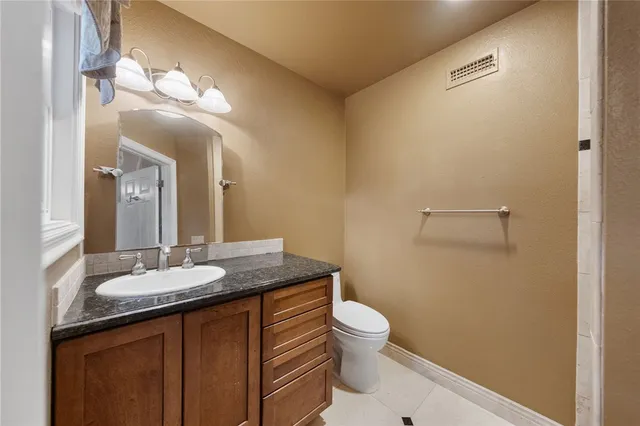 a bedroom with furniture and a large window