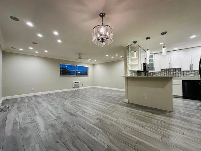 a view of a kitchen with cabinets